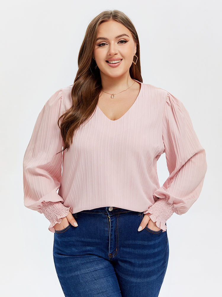 Bluse mit V-Ausschnitt und Puffärmel