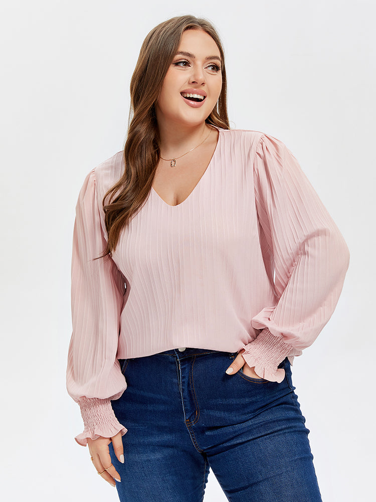 Bluse mit V-Ausschnitt und Puffärmel